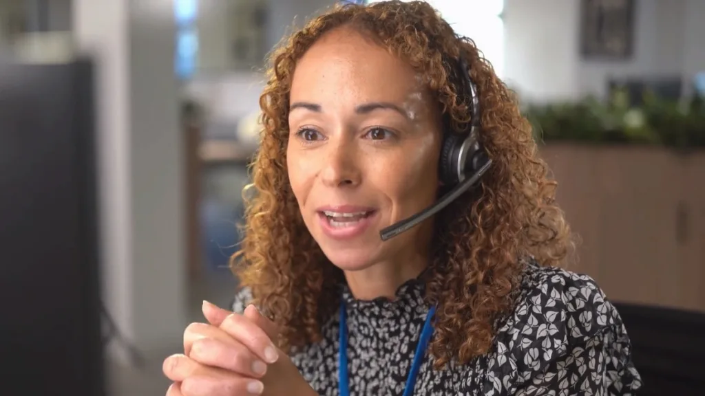 A counselor talking into her headset.